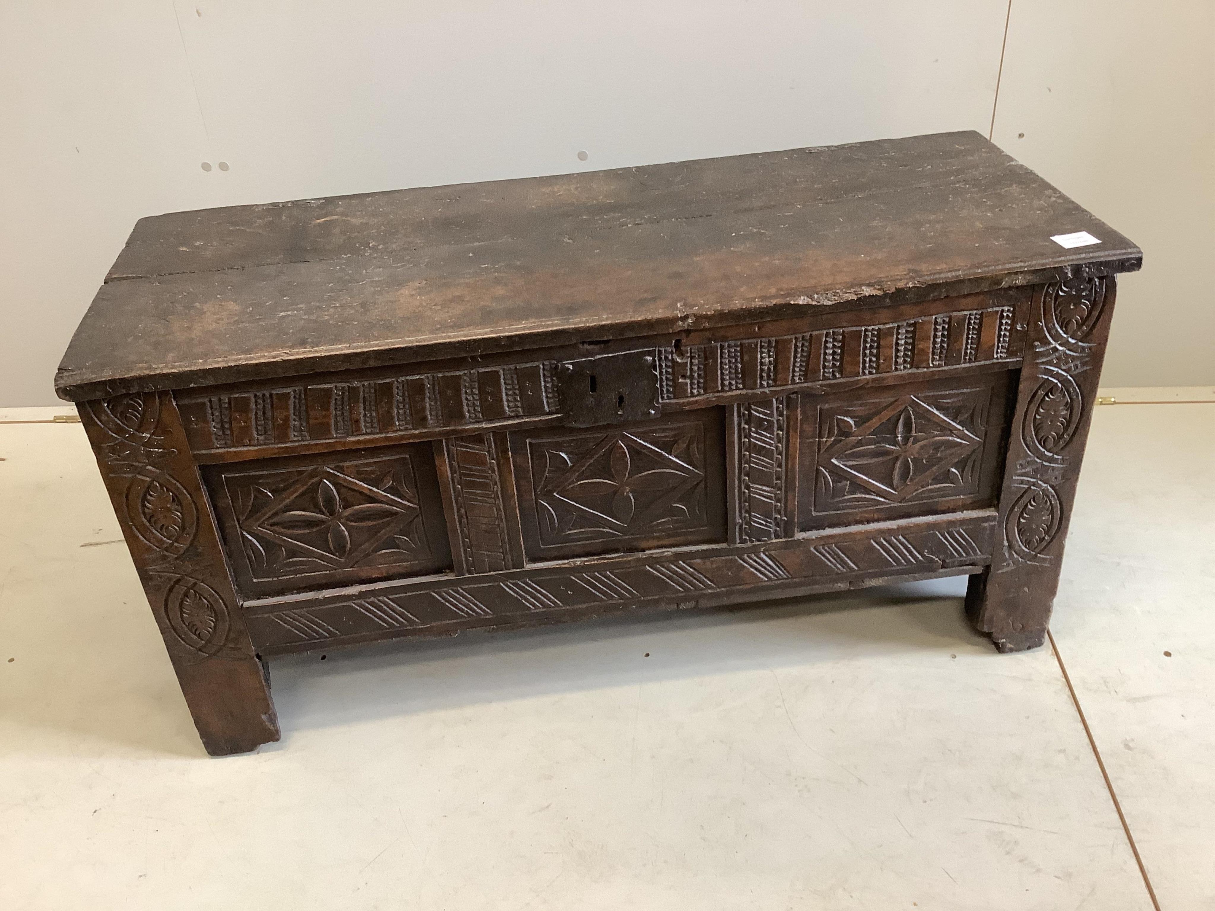 A 17th century triple panelled carved oak coffer, width 109cm, depth 42cm, height 54cm. Condition - poor-fair